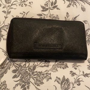 Gently used BCBG wallet in black with pink inside